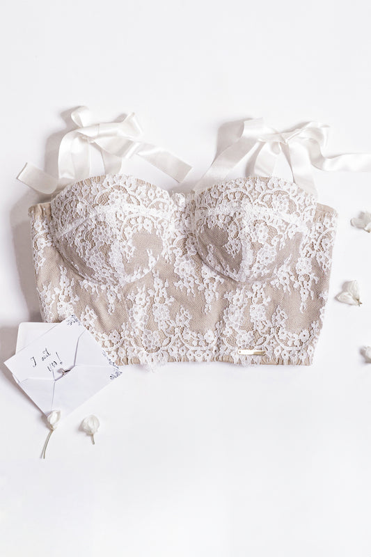 Bustier bianco in pizzo con spalline a fiocco